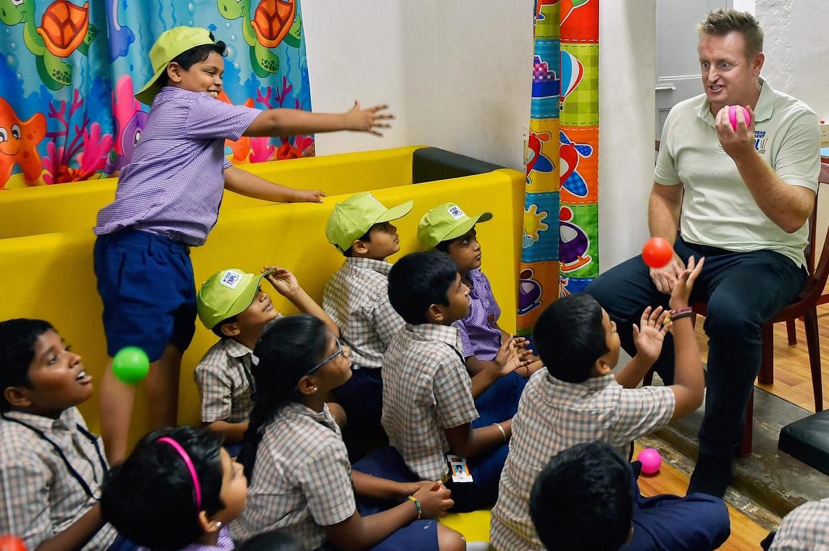 Former New Zealand cricketer Scott Styris interacts with specially-abled children, in Chennai on Monday. PTI Photo