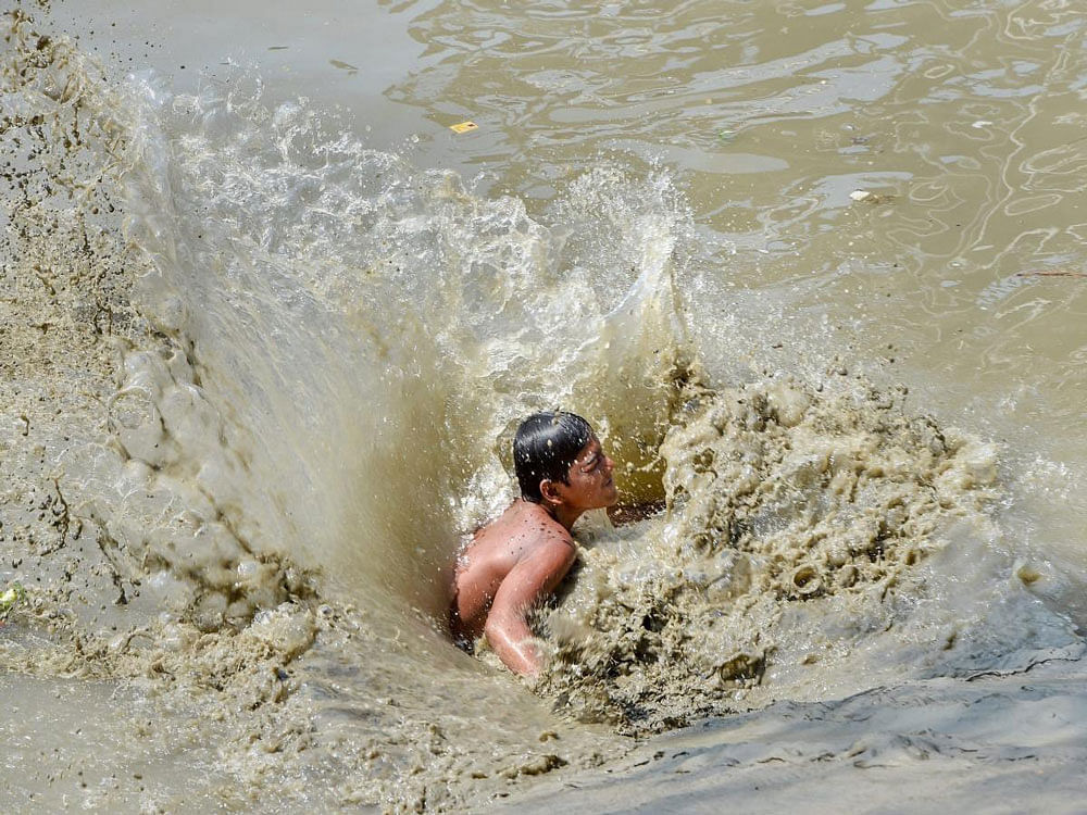 A young boy dives into River Ganga for a bath, in Kolkata on Wednesday. According to the UN, the theme for World Water Day 2018, observed on March 22, is ‘Nature for Water’ – exploring nature-based solutions to the water challenges we face in the 21st century. PTI Photo