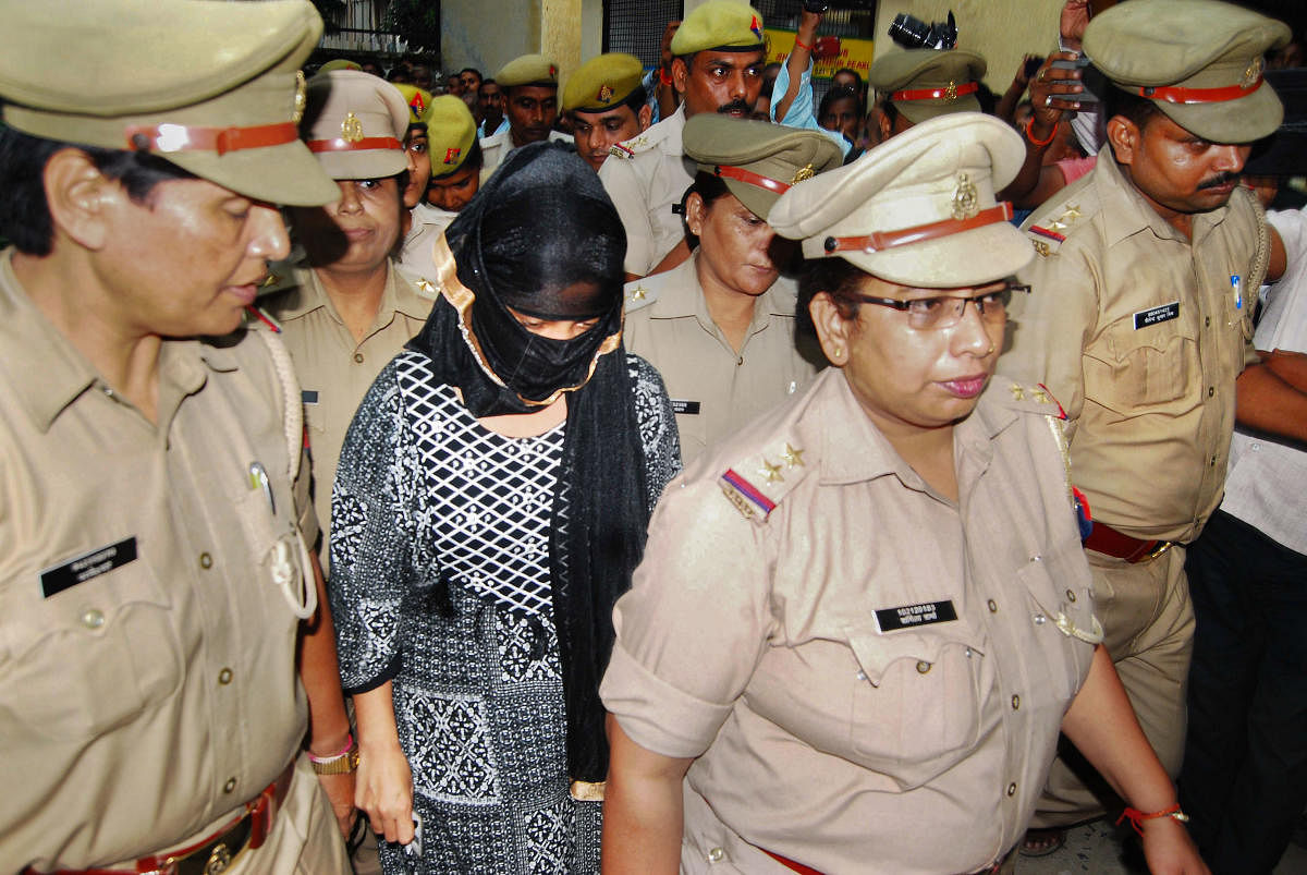 The 23-year-old law student, who has accused the BJP’s Swami Chinmayanand of raping her for more than a year, is brought to a local court to record her statement amid heavy security, in Shahjahanpur, Monday, Sept. 16, 2019. (PTI Photo)