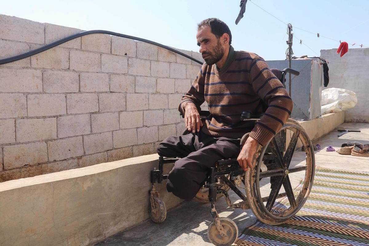 Syrian Ibrahim al-Ali sits in his wheelchair at the Deir Hassan camp for the displaced in Idlib's northern countryside near the Turkish border. (AFP Photo)