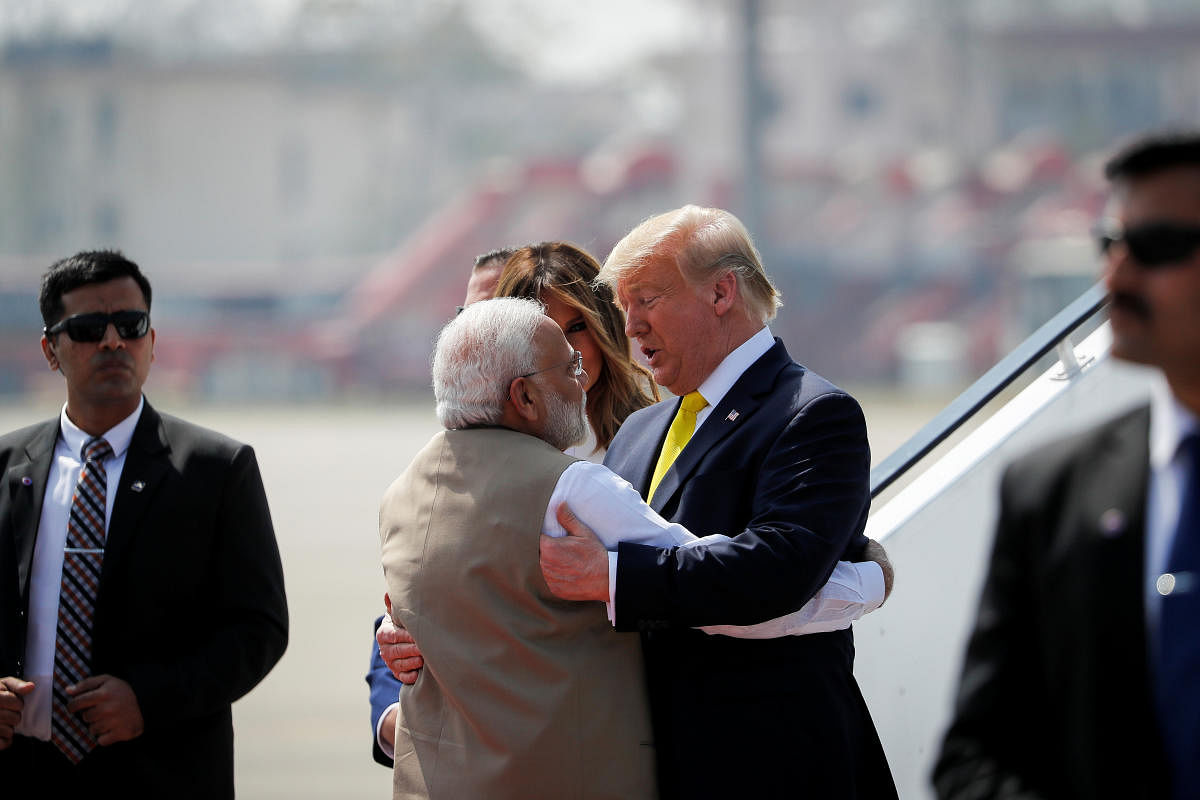 U.S. President Donald Trump greets Prime Minister Narendra Modi as he arrived at Sardar Vallabhbhai Patel International airport in Ahmedabad, India. (Reuters photo)