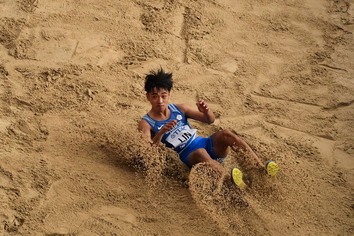 Taiwan's Lin Chia-Hsing competes in the Men's Long Jump heats at the 2019 IAAF World Athletics Championships at the Khalifa International stadium in Doha.  (AFP)