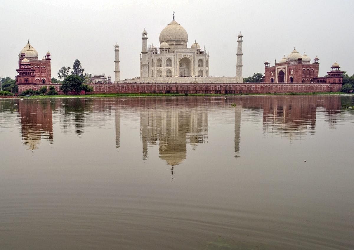 Agra: The water level of the Yamuna River rises, behind the Taj Mahal in Agra on Tuesday, July 31, 2018. (PTI Photo)