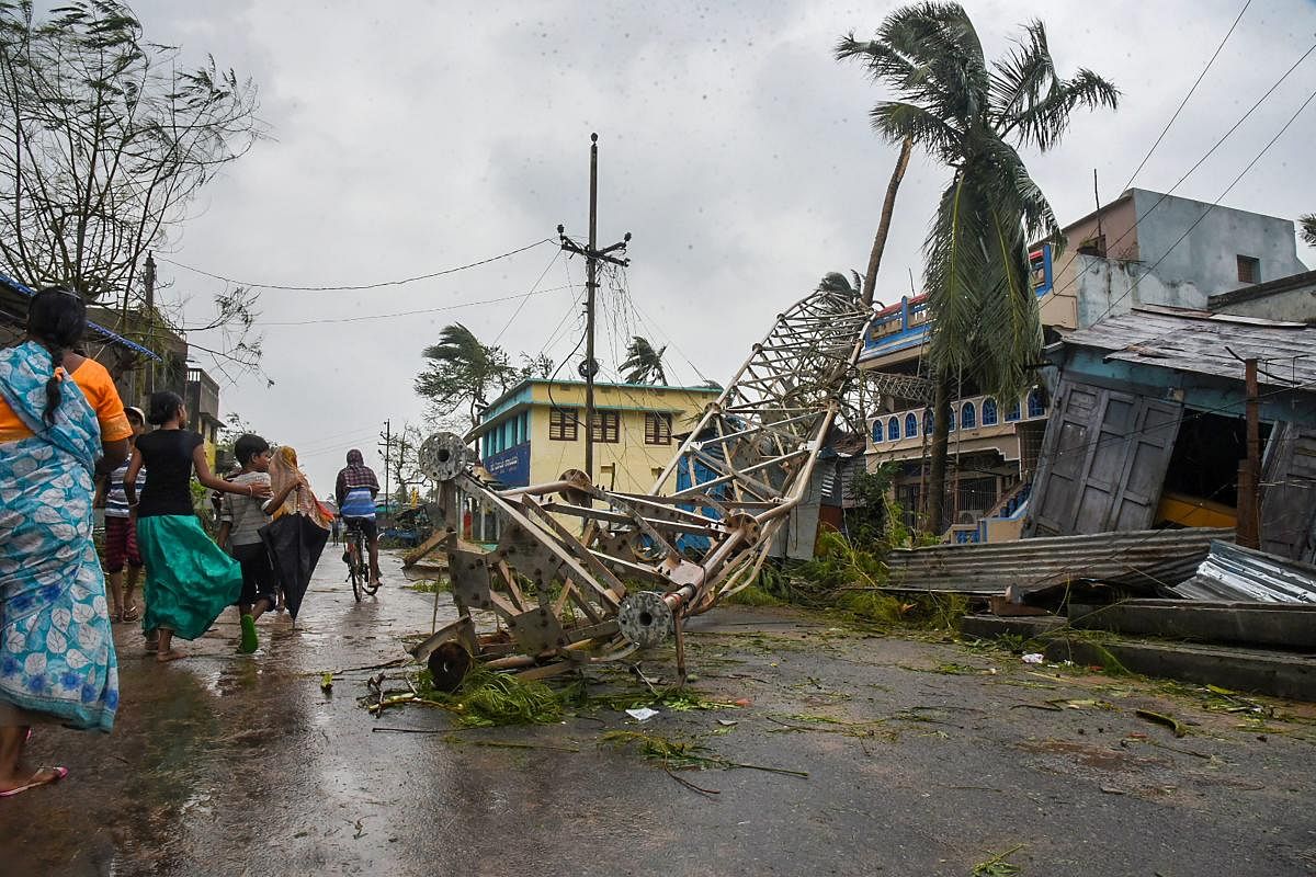 A damaged mobile tower seen struck down on road due to Cyclone Titli, at Barua village of Srikakulam.(PTI photo)