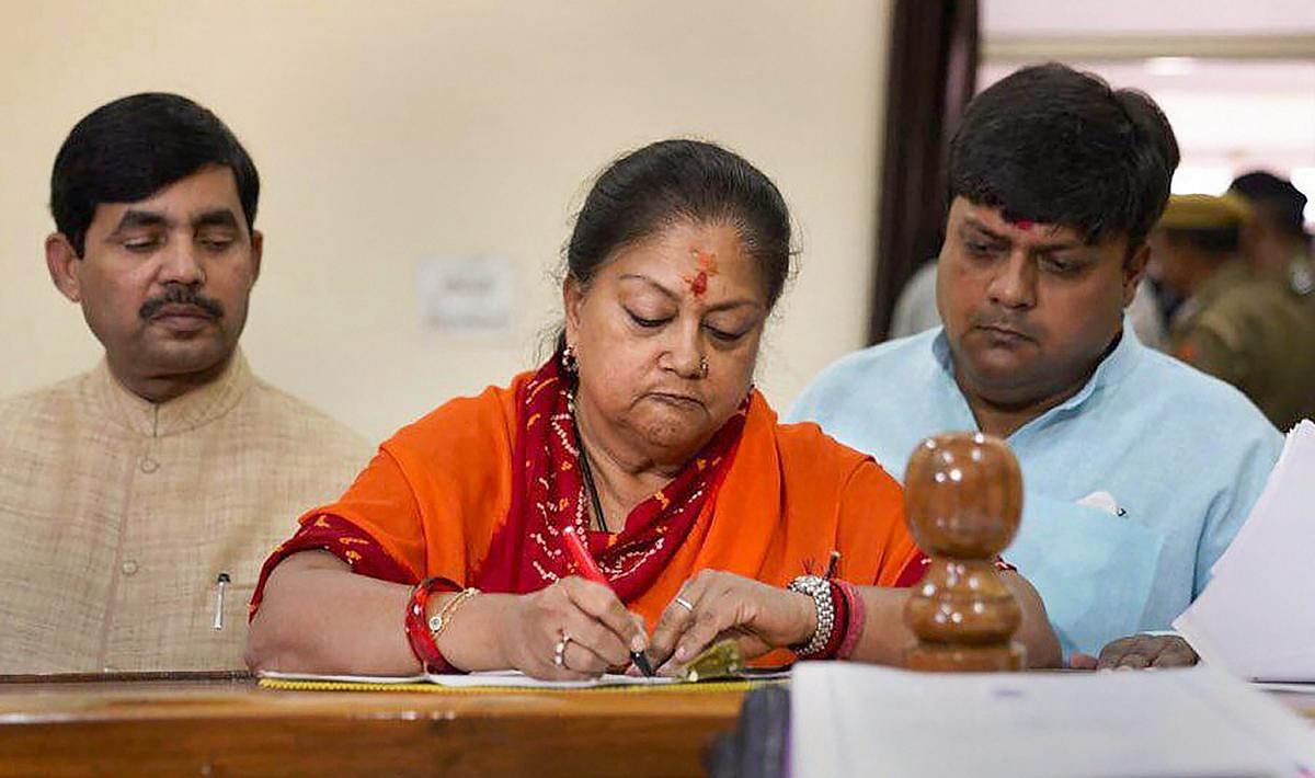 Rajasthan Chief Minister Vasundhara Raje, accompanied by BJP MP Dushyant Singh and Syed Shahnawaz Hussain, files her nomination papers for Assembly, at Jhalawar Secretariat in Rajasthan. PTI photo