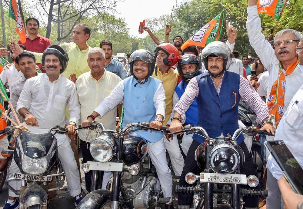 Delhi BJP President Manoj Tiwari takes part in the Bharatiya Janata Yuva Morcha's Vikas Yatra, in New Delhi on Sunday, June 3, 2018. PTI Photo