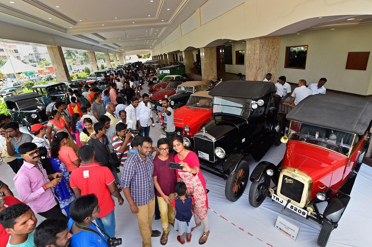 Auto enthusiasts take a selfie during vintage cars and motorcycles rally, in Chennai on Sunday. PTI photo