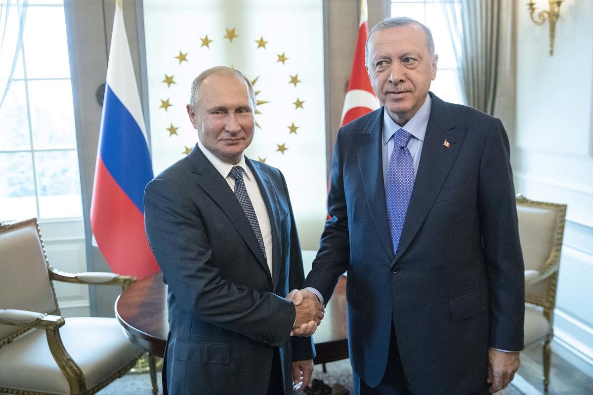 Russian President Vladimir Putin, left, and Turkey's President Recep Tayyip Erdogan shake hands during their meeting in Ankara, Turkey, Monday, Sept. 16, 2019. (AP/PTI Photo)
