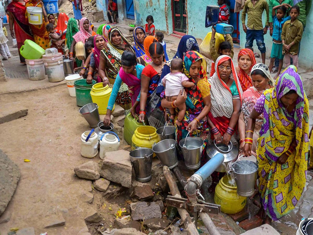 Women stand in a queue to collect drinking water from a tap, at Kubda Purwa colony in Mirzapur on Wednesday.According to the UN, the theme for World Water Day 2018, observed on March 22, is ‘Nature for Water’ – exploring nature-based solutions to the water challenges we face in the 21st century. PTI Photo