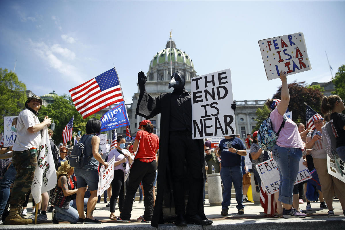 Protesters demonstrate during a rally against Pennsylvania's coronavirus stay-at-home order at the state Capitol in Harrisburg, Pa. Credit: AP Photo