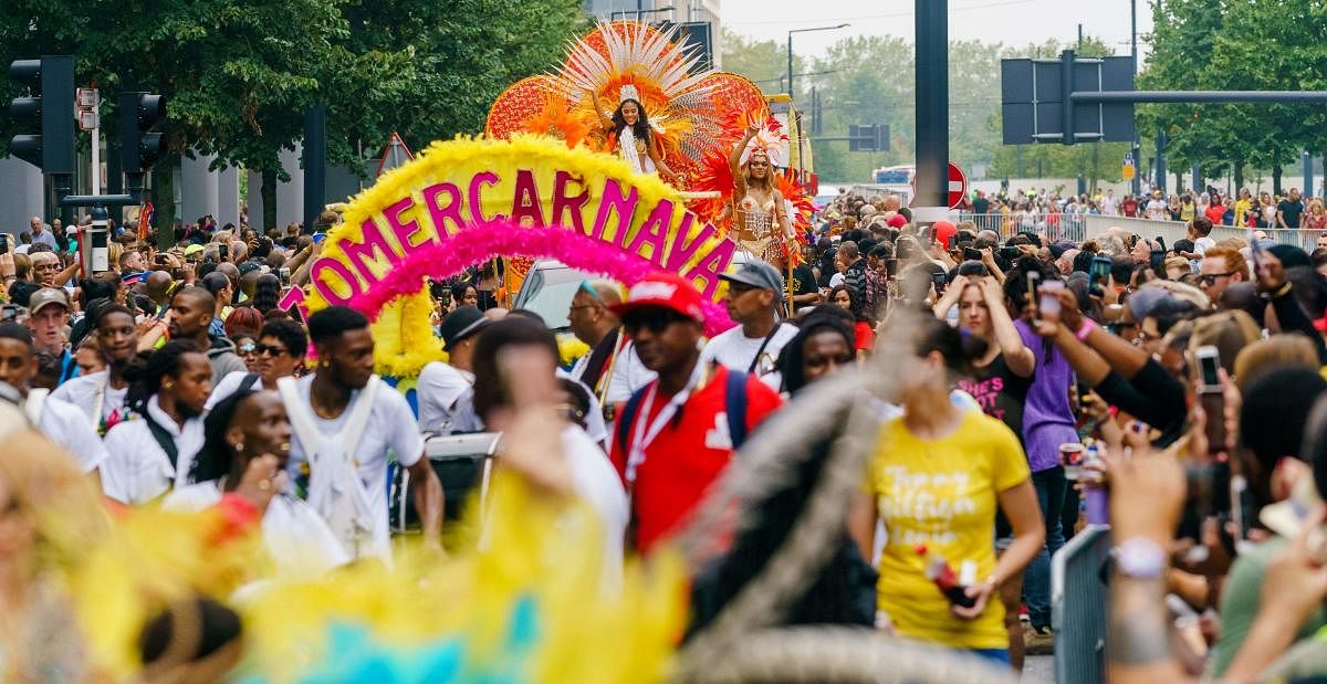 People take part in the Summer Carnival Street Parade in the streets of Rotterdam, on July 27, 2019. (AFP Photo)