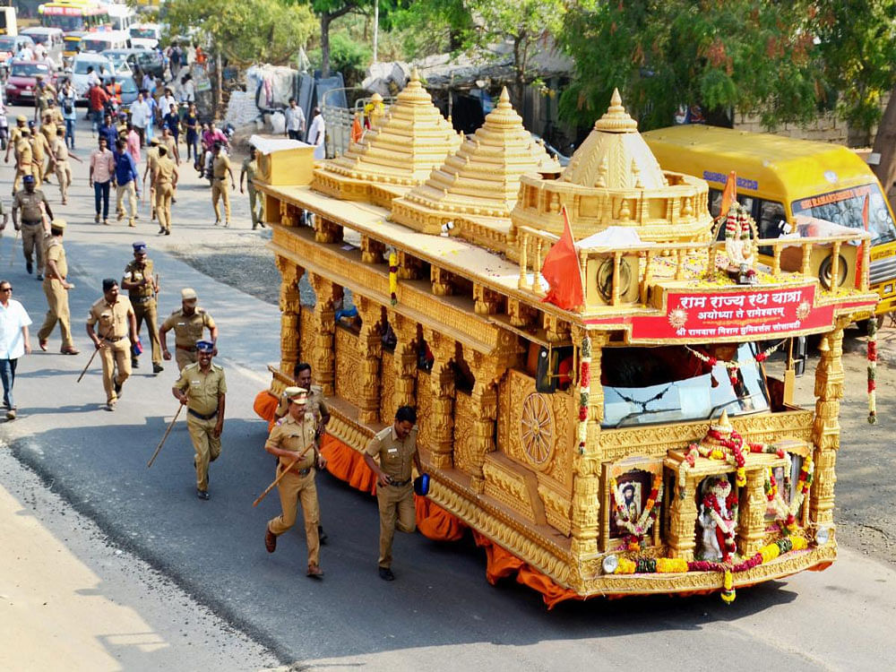 Chariot modelled on the proposed Ram Janma Bhoomi TemplePolice personnel run along side the chariot modelled on the proposed Ram Janma Bhoomi Temple travelling as a part of Ram Rajya Rath Yatra, organised by Vishwa Hindu Parishad (VHP), from Ayodhya to Rameswaram as it reached Madurai on Tuesday. PTI Photo