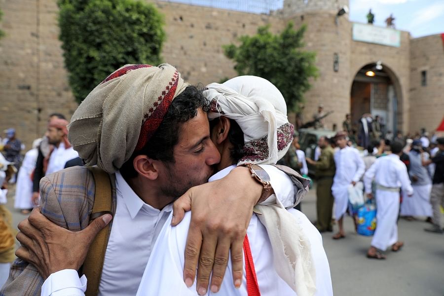 detainee hugs a relative after his release by the Houthis outside the central prison of Sanaa, Yemen. (Reuters)
