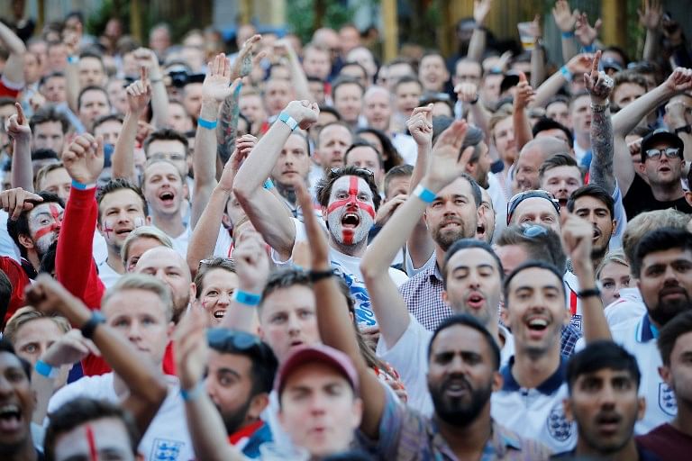 England fans react as they watch the Russia 2018 World Cup round of 16 football match between Colombia and England on a big screen in London on July 3, 2018. Tolga AKMEN / AFP