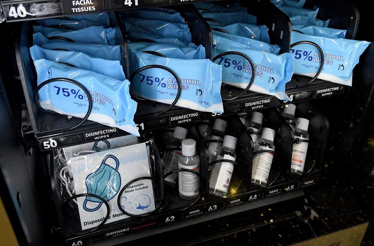 Alcohol disinfecting wipes, masks and bottles of hand sanitizer gel are displayed in a personal protective equipment vending machine in the Terminal 1 ticketing area at McCarran International Airport on May 14, 2020 in Las Vegas, Nevada. The airport used its social media platforms on Thursday to report that it was the first to install the machines that sell items such as masks, gloves and hand sanitizer. The nation's 10th busiest airport recorded a 53% decrease in arriving and departing passengers for March compared to the same month in 2019, a drop of more than 2.3 million travelers, as the COVID-19 pandemic impacts the travel industry. (AFP Photo)