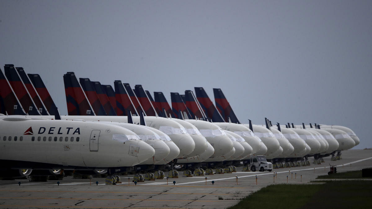 Several dozen mothballed Delta Air Lines jets are parked on a closed runway at Kansas City International Airport on Thursday, May 14, 2020, in Kansas City, Mo. The planes, some of the approximately 90 Delta jets parked at the airport, are among the thousands of passenger planes taken out of service worldwide as travel restrictions and stay-at-home orders due to the new coronavirus has drastically reduced air travel. AP/PTI