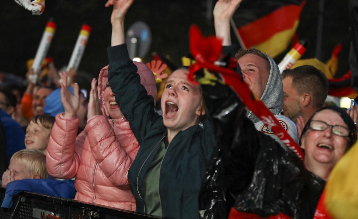 World Cup - Group F - Germany vs Sweden - Berlin, Germany - June 23, 2018 Germany soccer fans react as they watch the match at public viewing area at Brandenburg Gate. Reuters