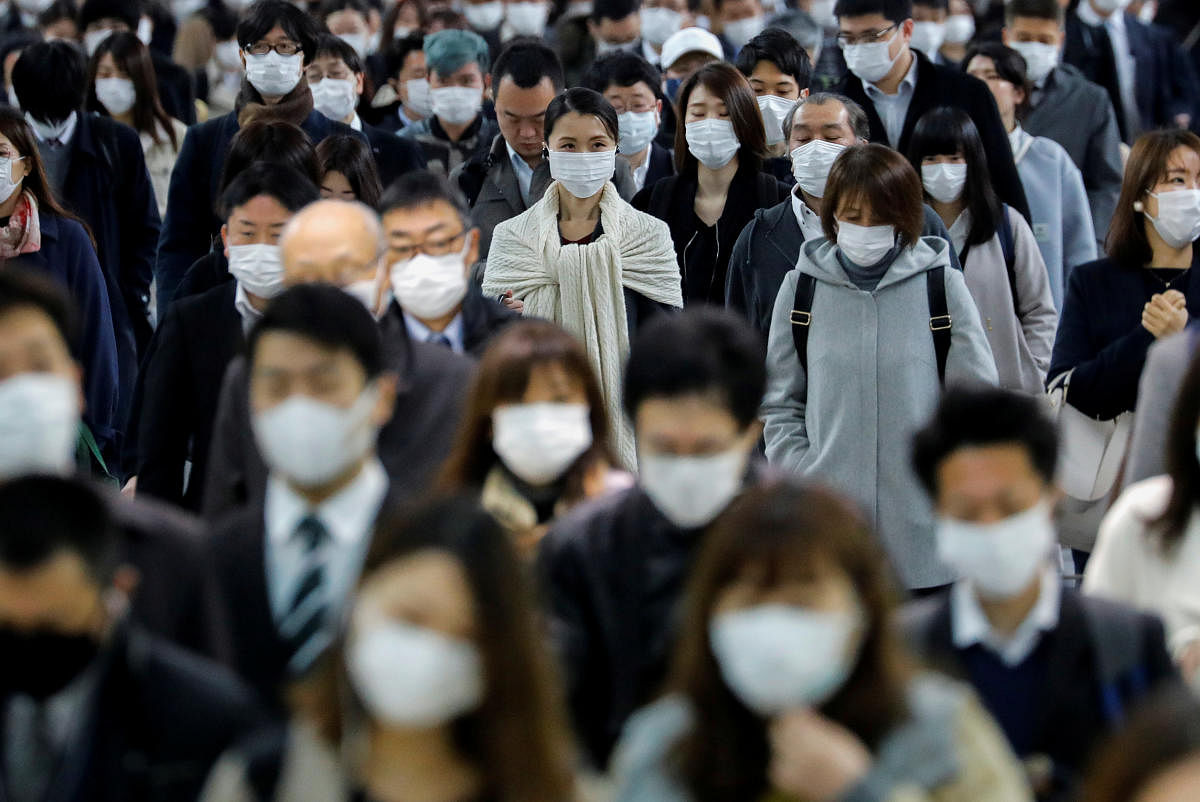 People wear face masks at Shinagawa station during the rush hour after the government expanded a state of emergency to include the entire country following the coronavirus disease (COVID-19) outbreak, in Tokyo, Japan, April 20, 2020. Credit: Reuters Photo