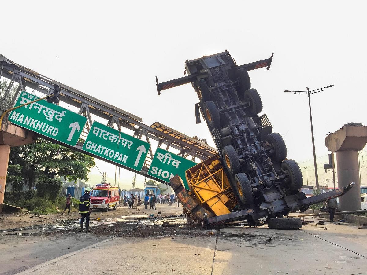 A damaged lorry after it met with an accident on Vashi Mankurdh highway, Navi Mumbai on Sunday. (PTI Photo)