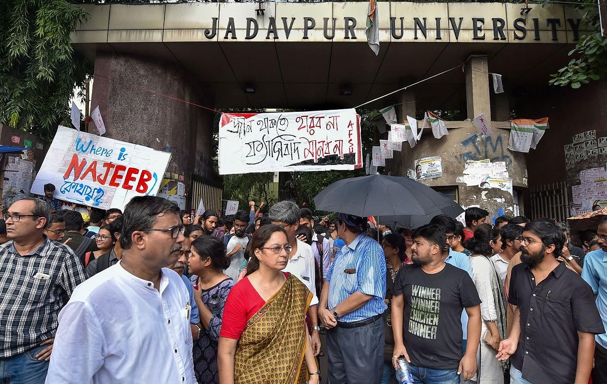 Faculty of Jadavpur University and students stand guard infront of the University gate during Akhil Bharatiya Vidyarthi Parishad (ABVP)'s march in protest against attack on Central Minister Babul Supriyo at Jadavpur University on Sept. 19, in Kolkata, Monday, Sept. 23, 2019. PTI Photo