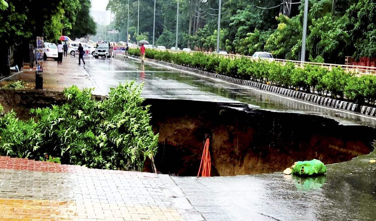 Amritsar: A road caves in after continuous rains during monsoon rainfall, in Amritsar, Sunday, Sept 23, 2018. (PTI Photo)