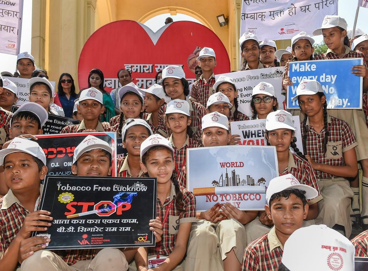 School children take part in an awareness rally against the use of tobacco at GPO in Lucknow on Friday. PTI Photo