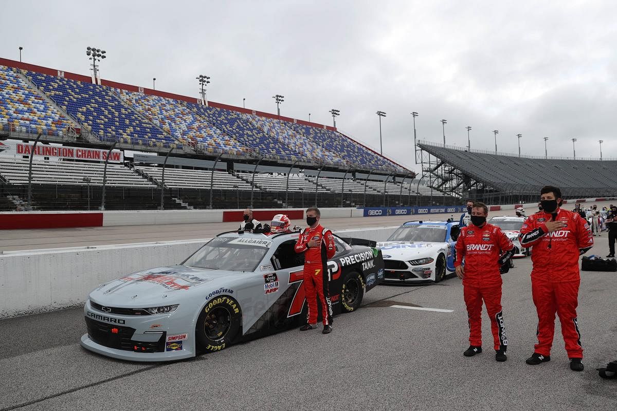 ustin Allgaier, driver of the #7 Precision Build Chevrolet, stands on the grid during the NASCAR Xfinity Series Toyota 200 at Darlington Raceway in Darlington, South Carolina. (AFP Photo)