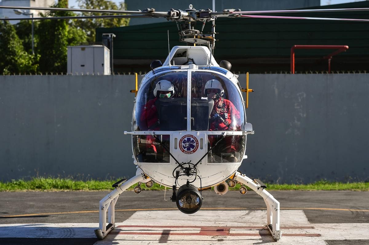 Argentine Comandant Javier Revilla and pilot Miguel Belharch prepare the take off aboard the emergency helicopter of the Medical Emergency System (SAME) of Buenos Aires. (AFP Photo)