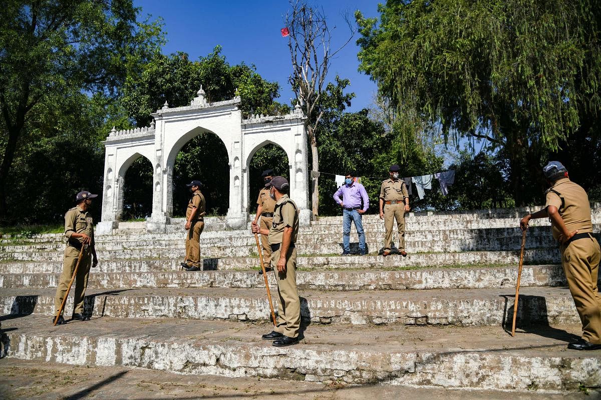 Police personnel stand guard at an Eidgah where Eid-al-Fitr prayers were not allowed due to ongoing COVID-19 lockdown, in Dehradun, Monday, May 25, 2020. (PTI Photo)