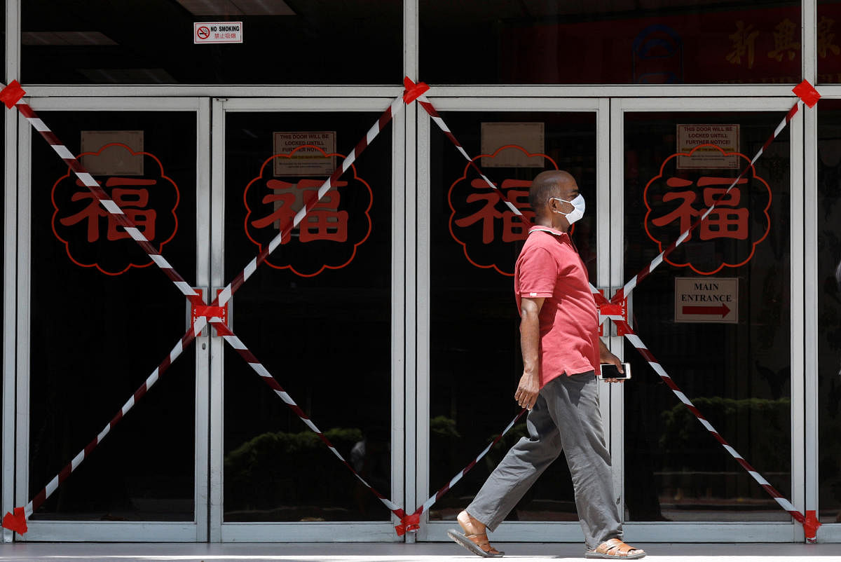 A man passes a closed off mall amid the coronavirus disease (COVID-19) outbreak in Singapore May 26, 2020. (Reuters photo)