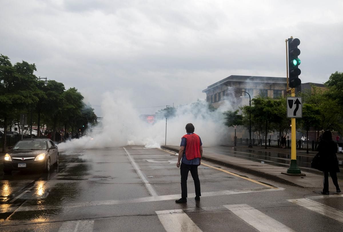 Tear gas is fired into the street outside the 3rd Precinct Police Precinct on May 26, 2020 in Minneapolis, Minnesota. Four Minneapolis police officers have been fired after a video taken by a bystander was posted on social media showing Floyd's neck being pinned to the ground by an officer as he repeatedly said,