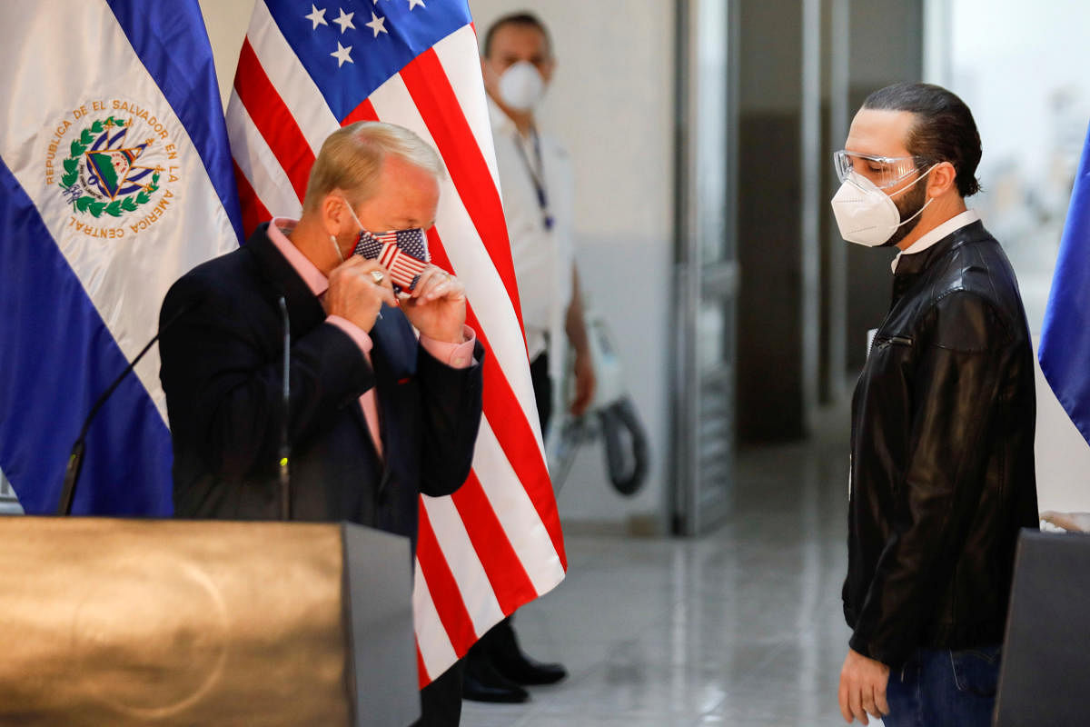 U.S. Ambassador to El Salvador Ronald Johnson adjusts his face mask after a joint news conferece with El Salvador's President Nayib Bukele during a nationwide quarantine as El Salvador's government undertakes steadily stricter measures to prevent the spread of the coronavirus disease (COVID-19), in San Salvador, El Salvador. (Reuters photo)