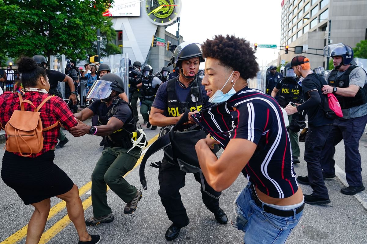 Police clash with demonstrators while making arrests during a protest in response to the police killing of George Floyd on May 30, 2020 in Atlanta, Georgia. Across the country, protests have erupted following the recent death of George Floyd while in police custody in Minneapolis, Minnesota in the most recent in a series of deaths of black Americans by the police. Elijah Nouvelage/Getty Images/AFP