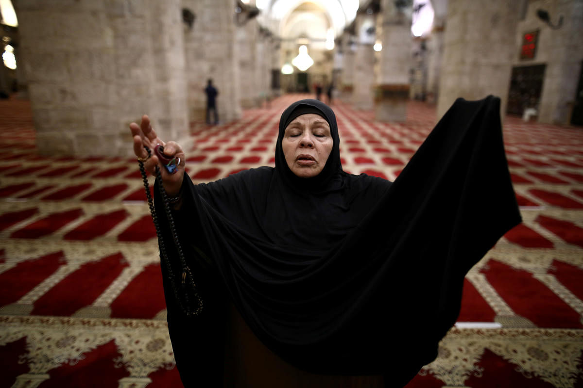 A worshipper prays inside al-Aqsa mosque as it reopened to worshippers after a two-and-a-half month coronavirus closure, on the compound known to Muslims as the Noble Sanctuary and to Jews as the Temple Mount in Jerusalem's Old City May 31, 2020. REUTERS