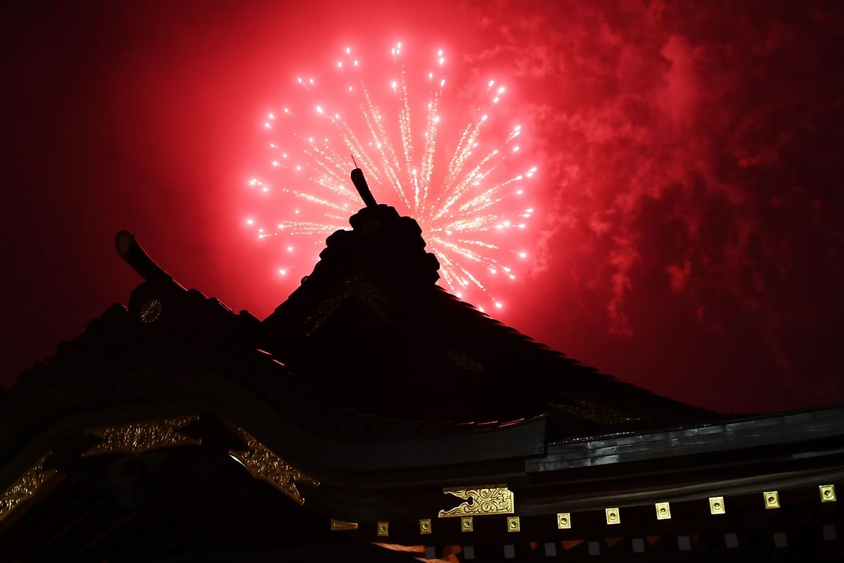 Fireworks explode over the Okunitama shinto shrine in Fuchu in the western suburbs of Tokyo on June 1, 2020. (Credit: AFP Photo)