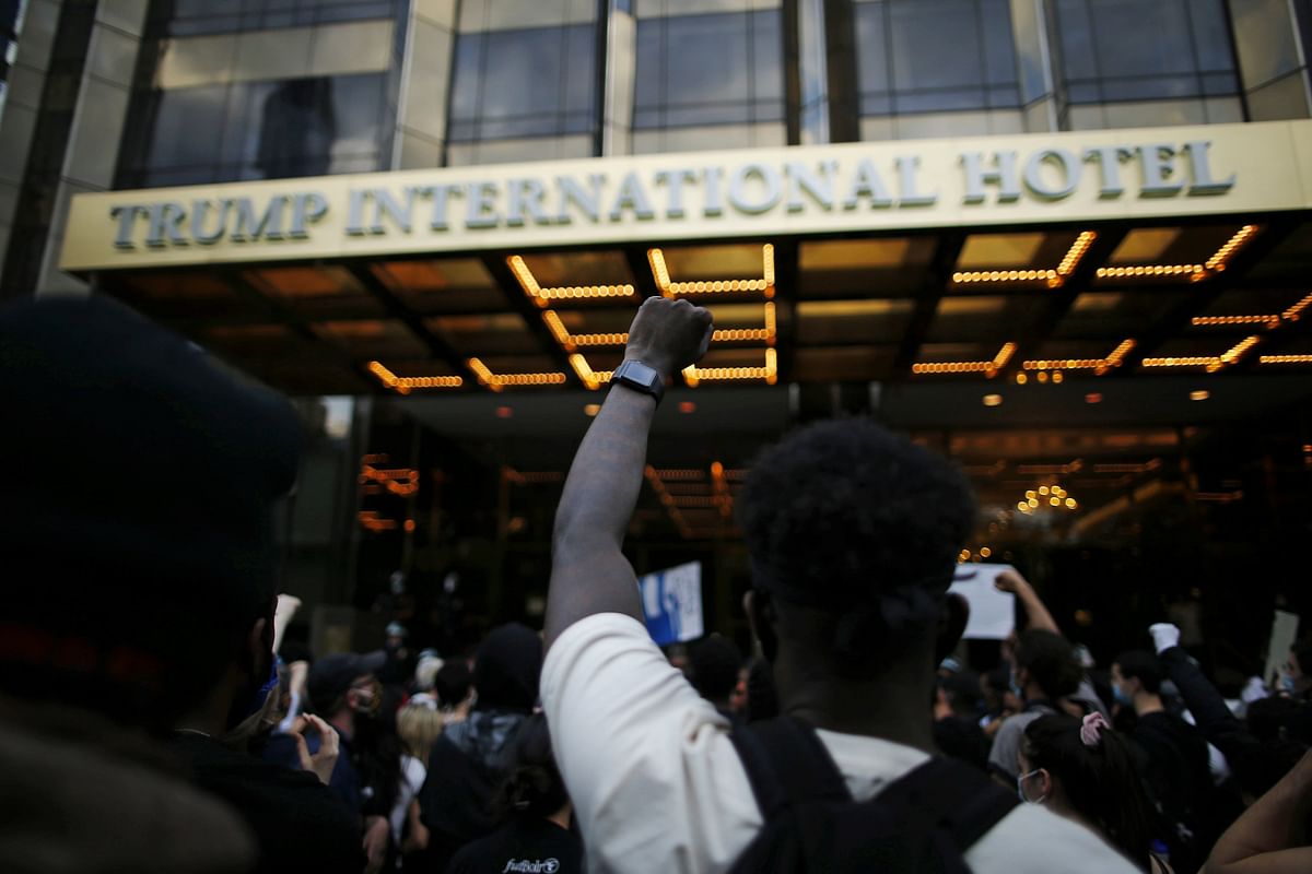 People take part in a protest against the death in Minneapolis police custody of George Floyd, at Trump International Hotel in New York. (Credit: Reuters Photo)