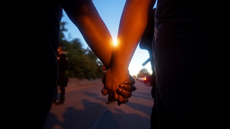 Protesters hold hands while shutting down highway exits and entries during a protest against the death in Minneapolis police custody of George Floyd, in St Louis, Missouri. (Reuters Photo)
