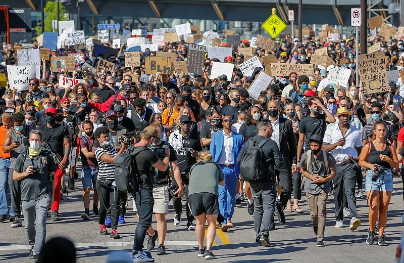Thousands of protesters march from downtown to the site of the arrest of George Floyd, who died while in police custody, in Minneapolis. (Reuters Photo)