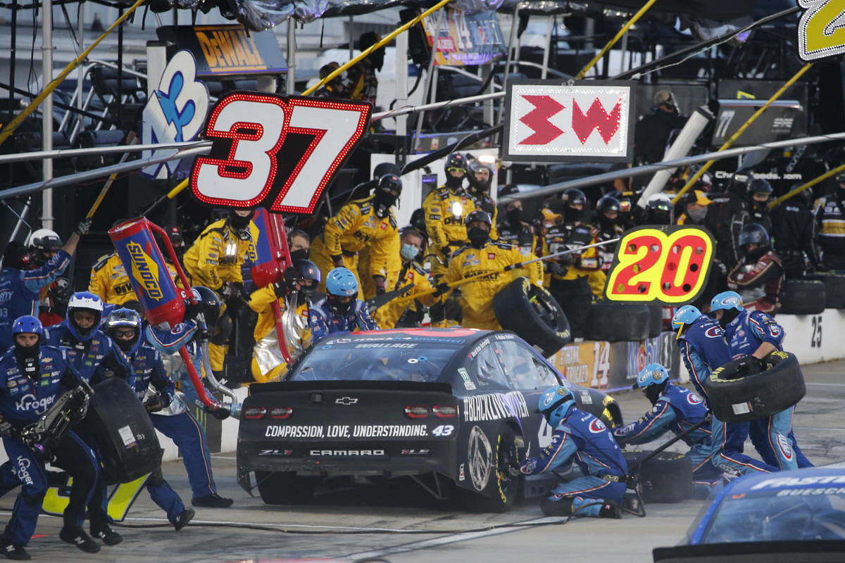 NASCAR driver Bubba Wallace (43) makes a pit stop during the NASCAR Cup Series at Martinsville at Martinsville Speedway. Credit/Steve Helber/Pool Photo via USA TODAY Network