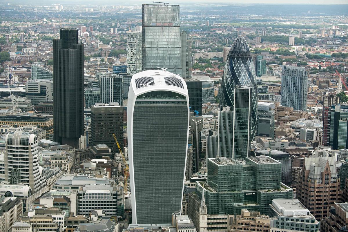 In this file photo taken on June 24, 2016 the City of London financial district including the Gherkin (R) and the 'Walkie Talkie' (C front) towers are seen from the air in London. Credit: AFP Photo