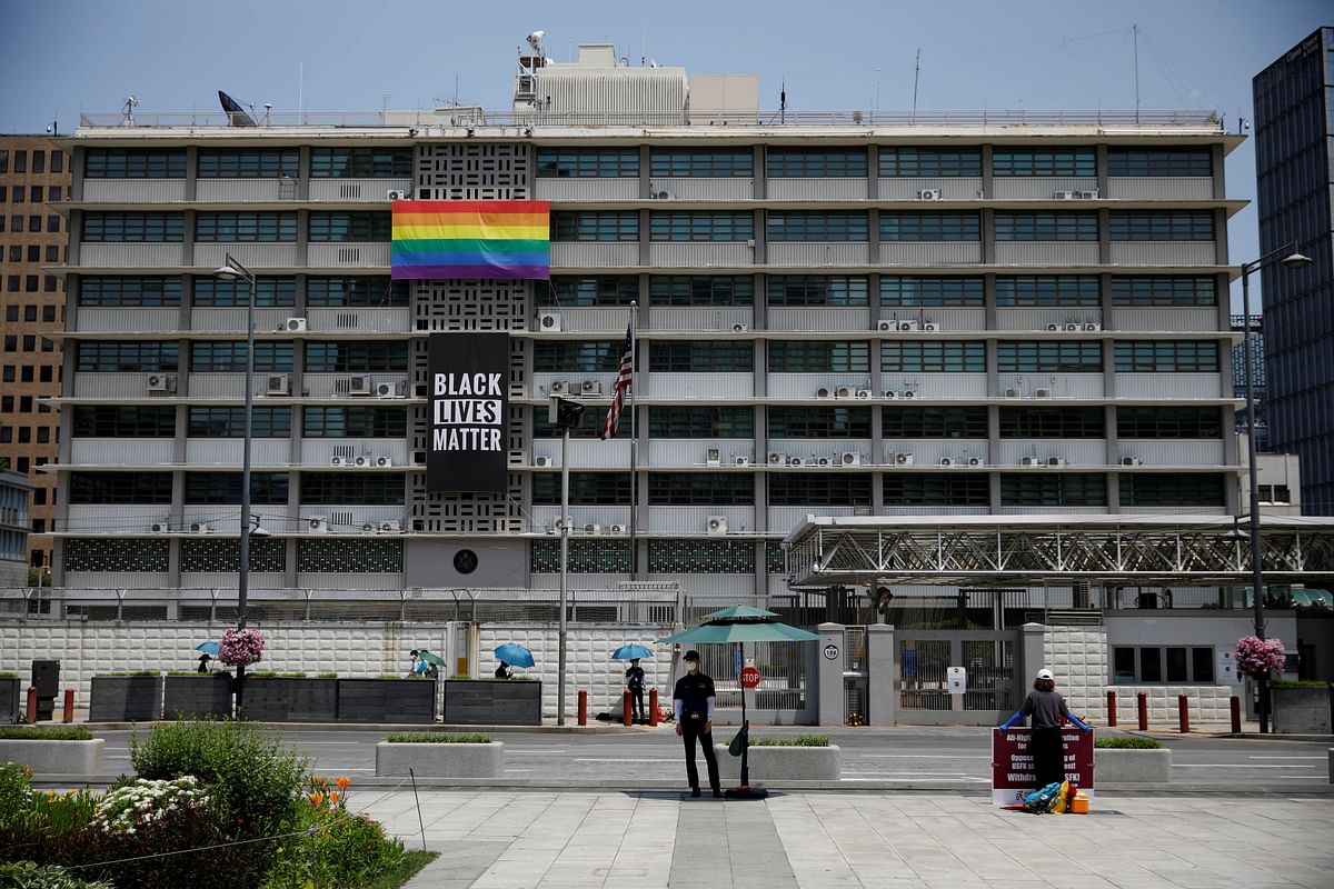 A huge Black Lives Matter banner is seen below a LGBT pride flag at the U.S. embassy in Seoul, South Korea. Credit: Reuters Photo