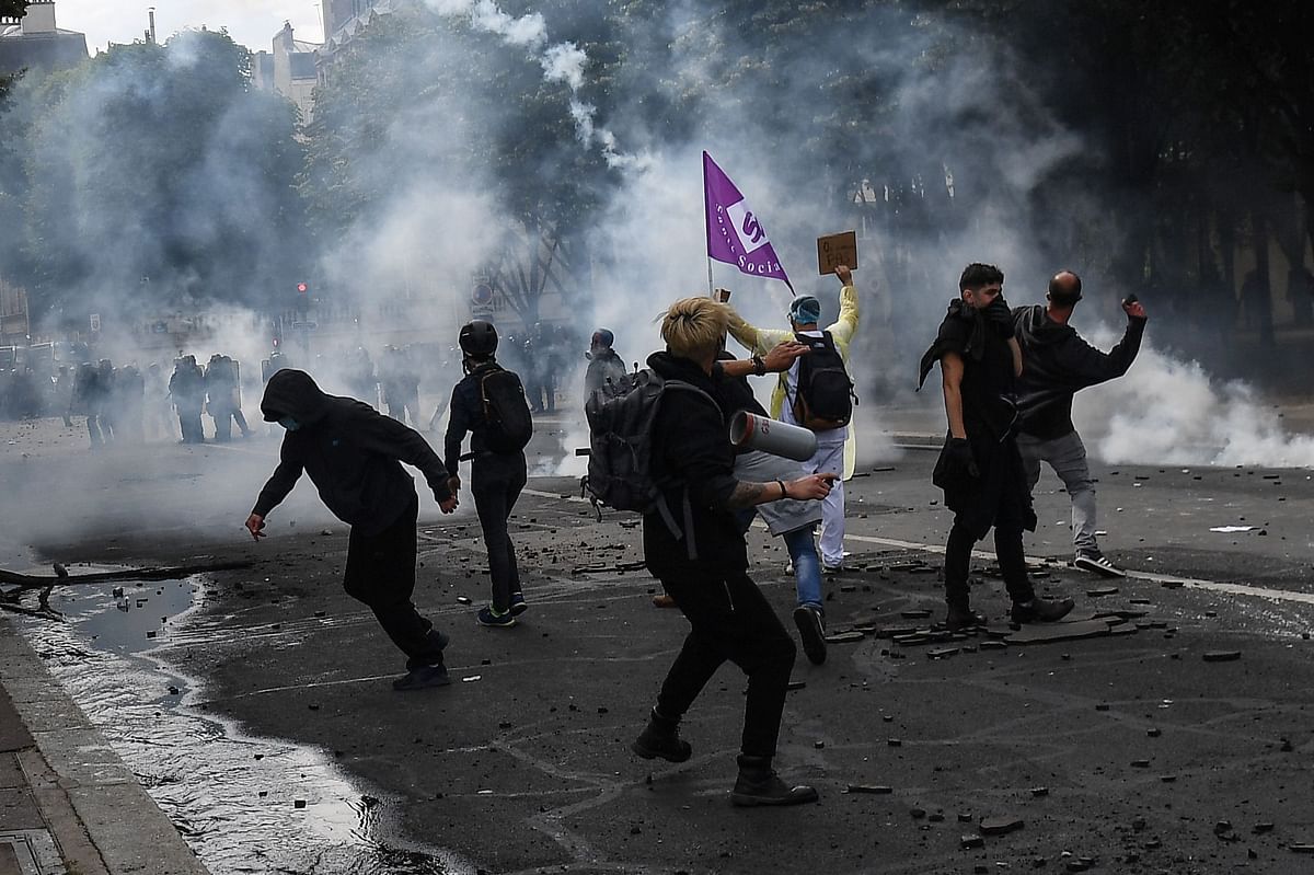 Protesters clash with police on the Invalides esplanade during a demonstration in Paris. Credit: AFP Photo