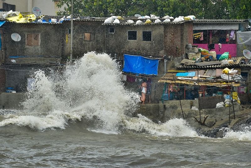 Waves crash ashore during high tide at Badhwar park, in Mumbai. Credits: PTI Photo