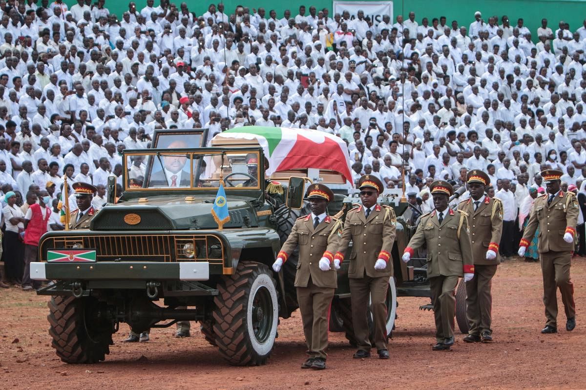 The coffin, covered with he Burundi national flag, of late Burundi President Pierre Nkurunziza, who died at the age of 55, is presented on a ceremonial vehicle during the national funeral at the Ingoma stadium in Gitega, Burundi, on June 26, 2020. Credit/AFP Photo
