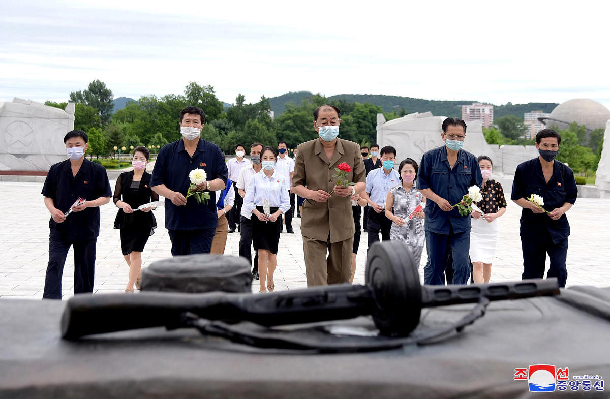 People lay flowers at a memorial to mark the 67th anniversary of the Korean War armistice in this undated photo released on June 26, 2020 by North Korea's Korean Central News Agency (KCNA) in Pyongyang.