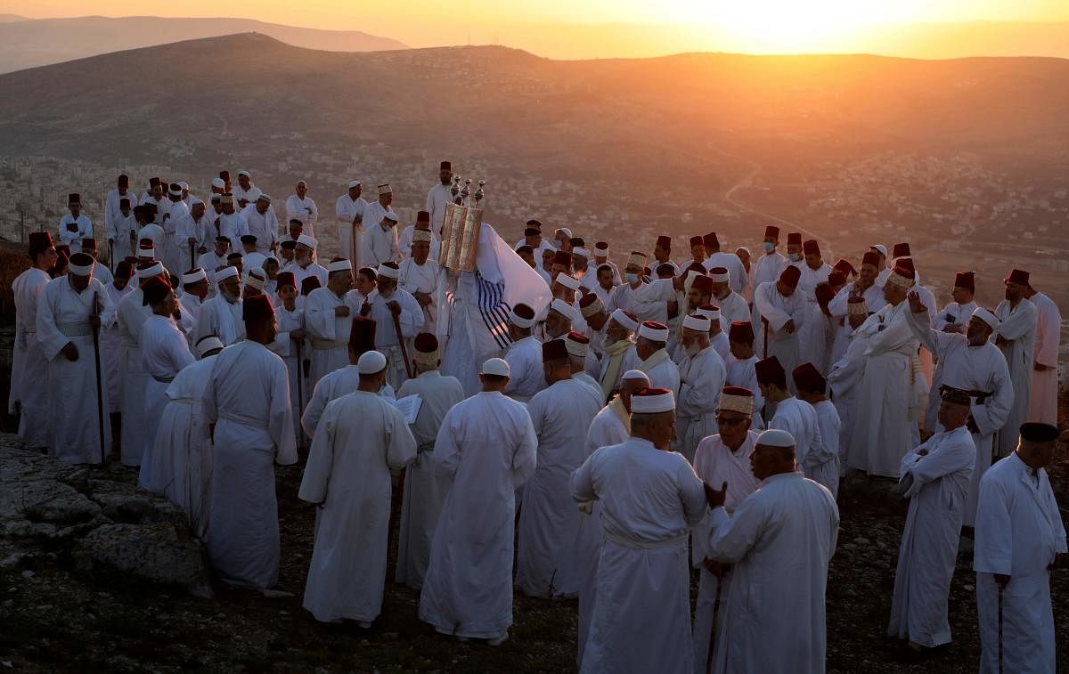 Samaritans gather to pray on top of Mount Gerizim near the northern West Bank city of Nablus as they celebrate the Shavuot festival at dawn, on June 28, 2020. Credit/AFP Photo