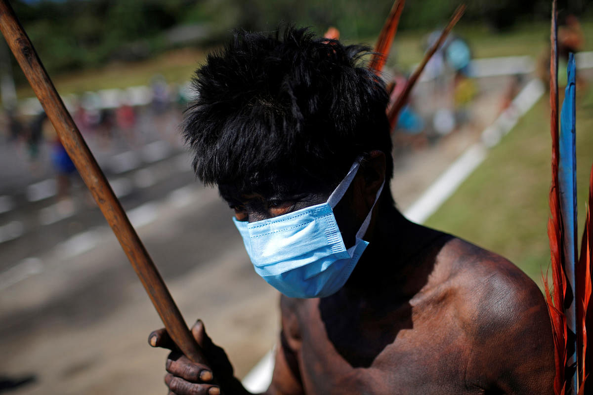 A man from the indigenous Yekuana ethnic group wearing protective face mask looks on, amid the spread of the coronavirus disease (COVID-19), at the 5th Special Frontier Platoon in the municipality of Auaris, state of Roraima, Brazil. Credit/Reuters Photo