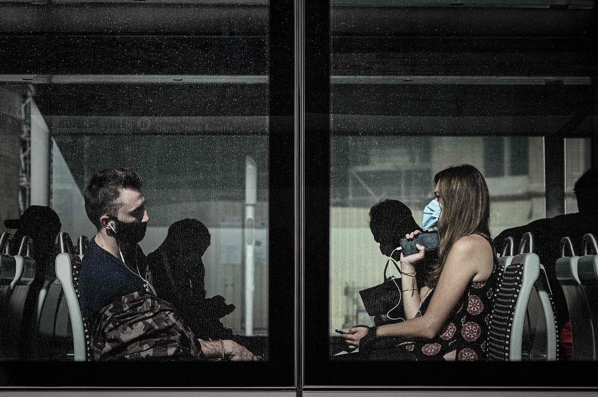 Commuters wearing face masks sit in a tramway in Bordeaux on July 3, 2020. Credit/AFP Photo