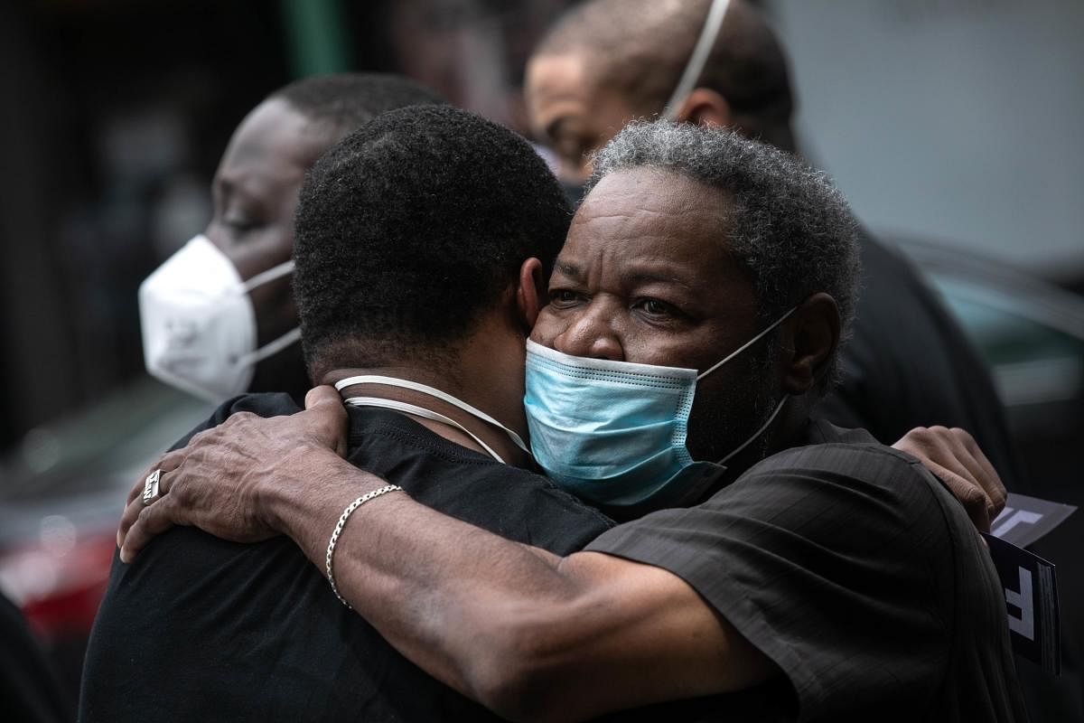 Friends and family mourn the death of Conrad Coleman Jr. following his funeral service on July 03, 2020 in New Rochelle, New York. Coleman, 39, died of COVID-19 on June 20, 2020, just over two months after his father Conrad Coleman Sr. also died of the disease. John Moore/Getty Images/AFP