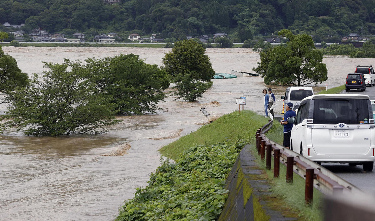 Rising water caused by a heavy rain is seen along Kuma river in Yatsushiro, Kumamoto prefecture, southern Japan, in this photo taken by Kyodo. Reuters/Kyodo